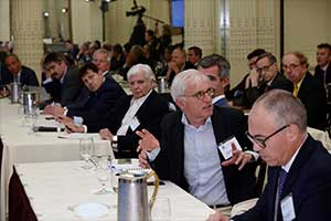 Photo of many physicians sitting at tables during the meeting
