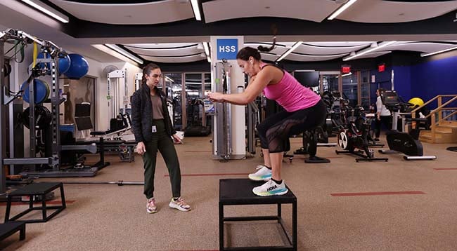 physical therapists working with patient