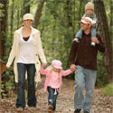 A family walking in the woods