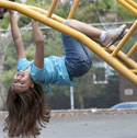 Photo of a child playing on a jungle gym