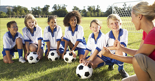 A girls and boys youth soccer team.