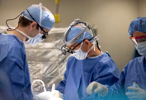 doctors at HSS performing spine surgery