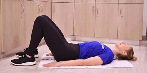 woman performing bridge exercise