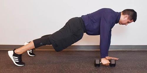 man doing plank rows