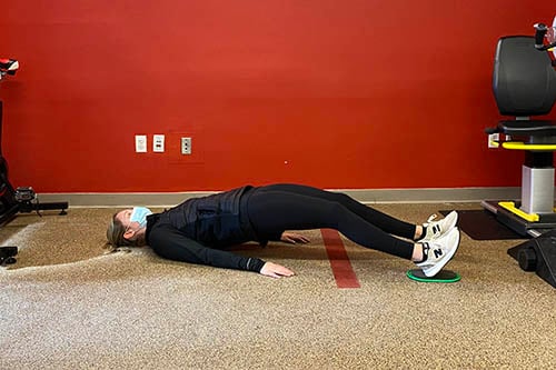 supine hamstring curl bridge position
