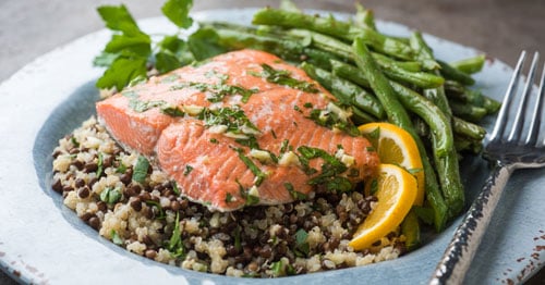 A dish with salmon and vegetables.