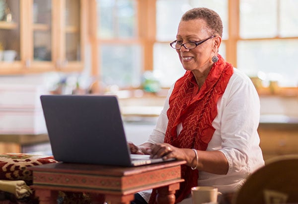 Woman browsing on her laptop
