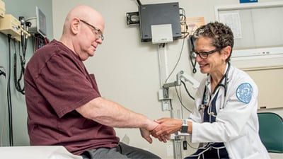 HSS rheumatologist with patient