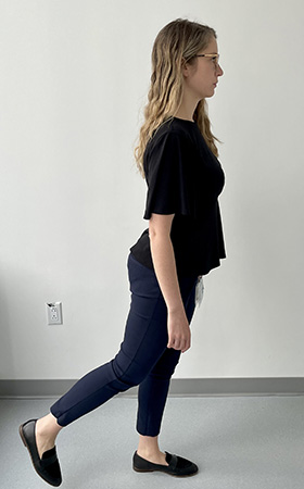 Image of a woman swinging her right leg back