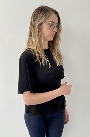 Image of a woman twisting her torso to her left