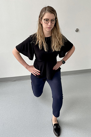 Image of a woman lunging with her left leg forward