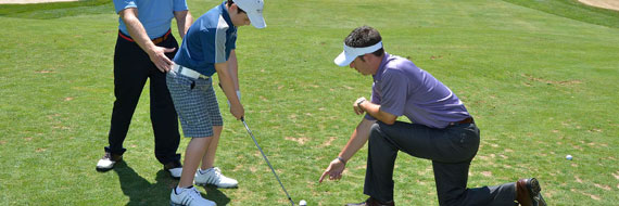 A golfer being instructed on safety