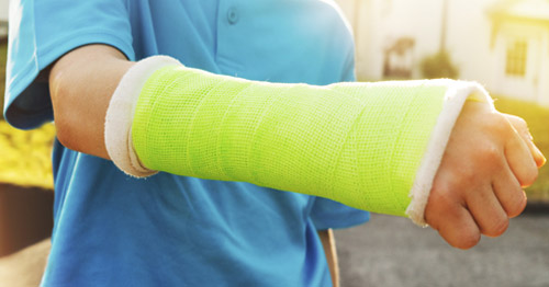 A child wearing a wrist cast.