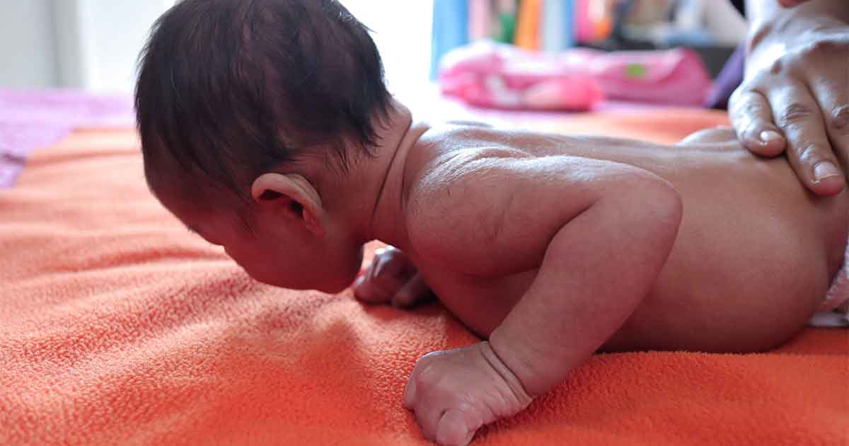 when do babies typically roll over from back to front